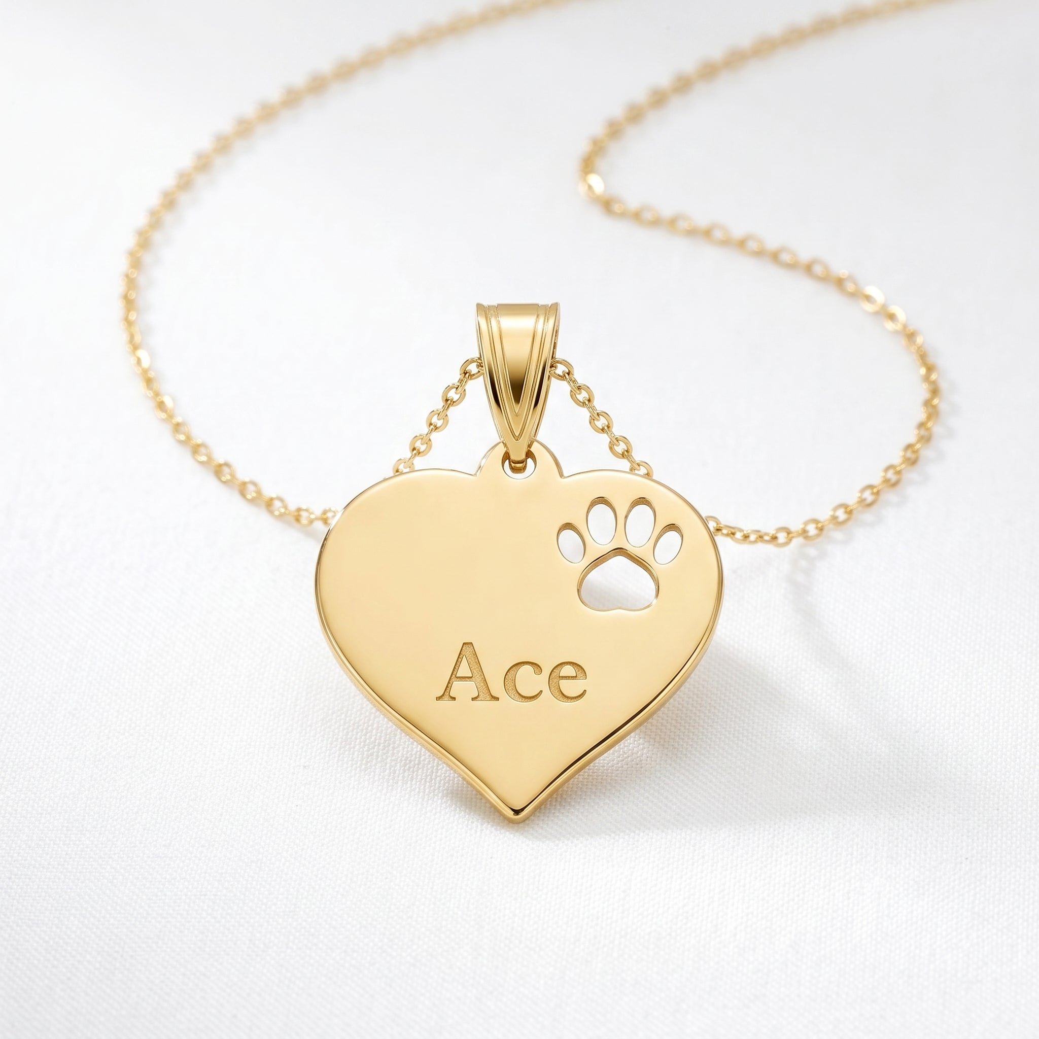 Elegant studio shot of polished 14K gold paw print pendant showing high-end finish and luxurious details.